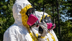 U.S. Air Force Airman 1st Class Raeven Anothony, 2nd Operational Medical Readiness Squadron bioenvironmental engineering technician, uses a walkie-talkie during a simulated nuclear response training