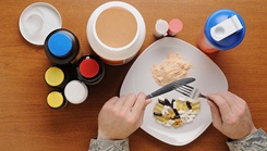 a plate of food with dietary supplements next to it