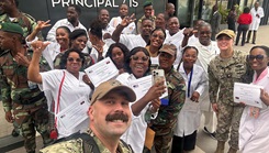 Lt. Cmdr. Patrick Marsh, assigned to Naval Hospital Jacksonville, poses for a photo with participants in his two-week Trauma Nursing and Surgical Trauma training