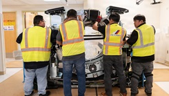 Workers at U.S Naval Hospital Guam (USNH Guam) install a new Revolution Ascend Plus 72 kilowatt computed tomography (CT) scanner