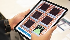 U.S. Navy hospital corpsman uses a tablet-based Traumatic Brain Injury assessment application during an end-user touchpoint