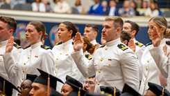 U.S. Navy medical graduates take the commissioning oath during the Uniformed Services University's 47th Commencement ceremony