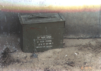 Figure 16. Ammunition box containing samples of material in tank