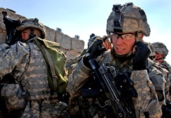 Soldier plugging his ears with his fingers