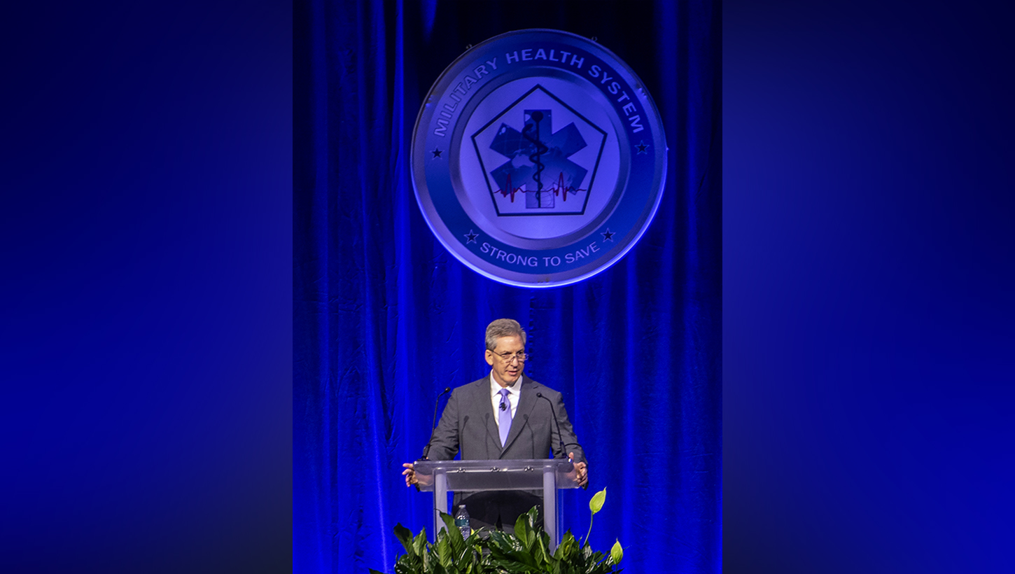 Top military health official kicks off annual symposium, encourages collaboration to ‘transform research into better care for those who serve’