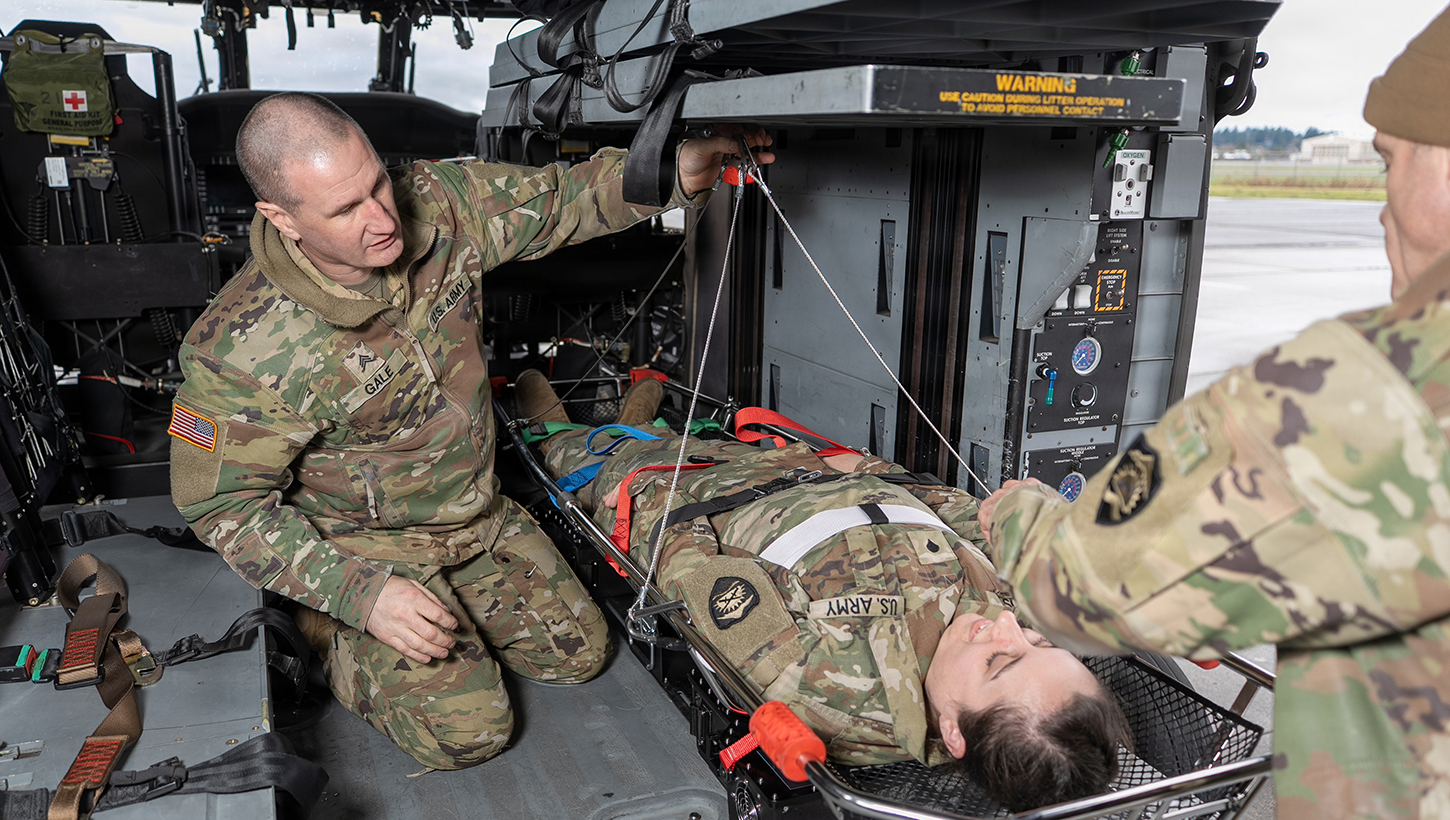 Image of Oregon National Guard uses new hoist technology in one of first live mountain rescues.