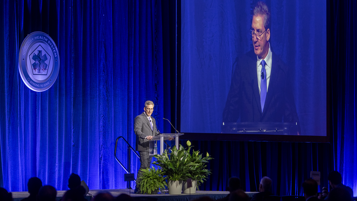 Top military health official kicks off annual symposium, encourages collaboration to ‘transform research into better care for those who serve’