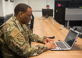 photo of solider working on a computer