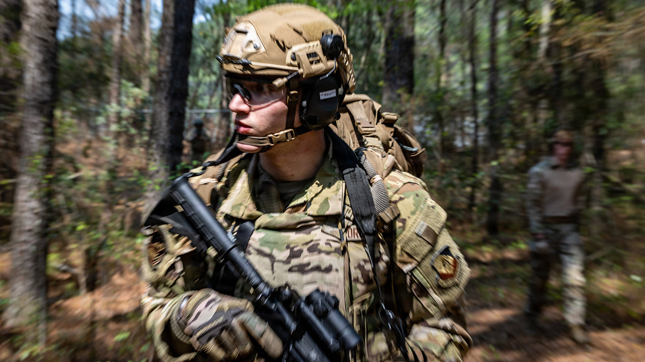 U.S. Air Force Senior Airman Luke Hirsch, 1st Combat Camera Squadron aerial combat camera journeyman, scans his surroundings during Scorpion Lens 2026 at Joint Base Charleston, South Carolina, March 19, 2026. Combat camera Airmen are specifically trained and equipped to rapidly deploy to austere combat environments and organically advise, produce and transmit the full spectrum of public affairs capabilities. (U.S. Air Force photo by Tech. Sgt. Kristen Heller)