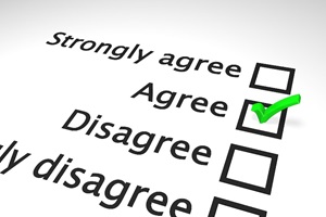 An image of a portion of a diagonally-positioned survey. There are four check-boxes: strongly agree, agree, disagree, and strongly disagree. There is a bright green checkmark in the "agree" box.