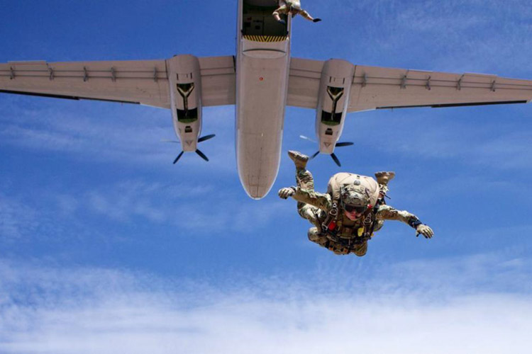 U.S. Air Force Capt. Hopkins, 351st Special Warfare Training Squadron, Instructor Flight commander and Chief Combat Rescue Officer (CRO) instructor, conducts a military free fall equipment jump from a DHC-4 Caribou aircraft in Coolidge, Arizona, July 17, 2021. Hopkins is recognized as the 2020 USAF Special Warfare Instructor Company Grade Officer of the Year for his outstanding achievement from January 1 to December 31, 2020.