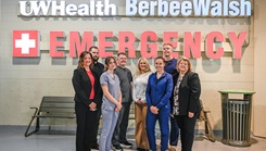 U.S. Airmen with the Wisconsin Air National Guard's 115th Medical Group work with UW Health hospital staff