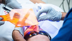 U.S. Air National Guard dental technician Airman 1st Class Brenda Cholula and dentist Lt. Col. Carl Todoro, both assigned to the 134th Medical Group, repair a chipped tooth on a patient during a training event