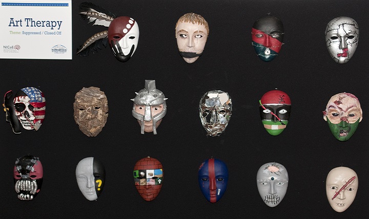 Art therapy masks on display at last year's Warrior Care in the 21st Century symposium demonstrate mechanisms to both expose and expunge service members' previously hidden wounds in a creative, non-threatening manner