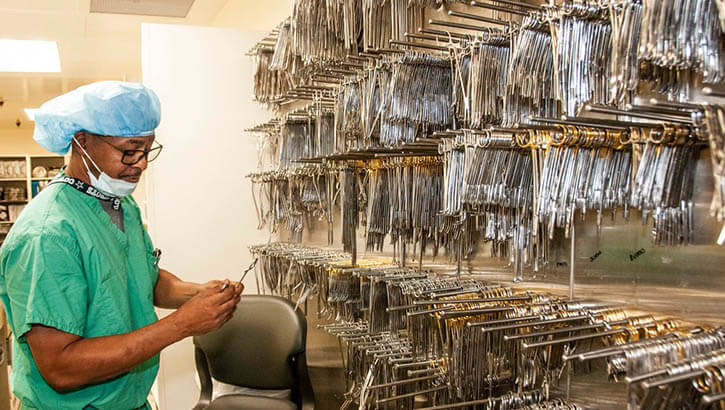 Image of A quality assurance specialist organizes sterilized instruments to prepare for packaging at the Sterile Processing Department, William Beaumont Army Medical Center in Texas. (Photo: Marcy Sanchez).