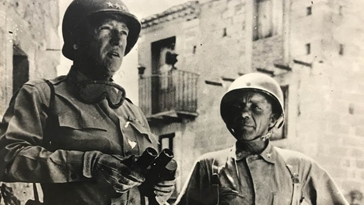 Image of Lt. Gen. George S. Patton and Brig. Gen. Theodore Roosevelt Jr. are pictured here in 1943 wearing the standard M1 helmet, sometimes called the "steel pot." (Photo: 1st Infantry Division Courtesy Photo).