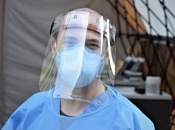 Medical personnel wearing a mask