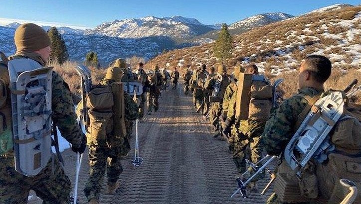 Image of Marines march during a cold weather leadership course.