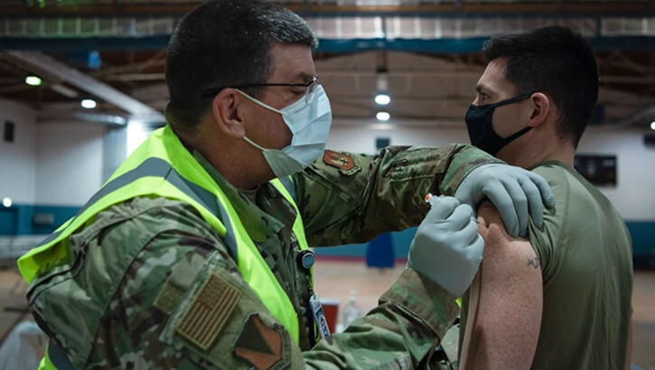 Military medical gives Soldier a COVID-19 vaccine