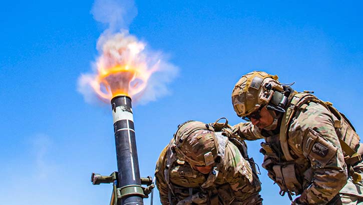 Army Col. Randy Lau fires a 120 mm mortar during a live-fire exercise at Camp Roberts, California, June 15, 2021.