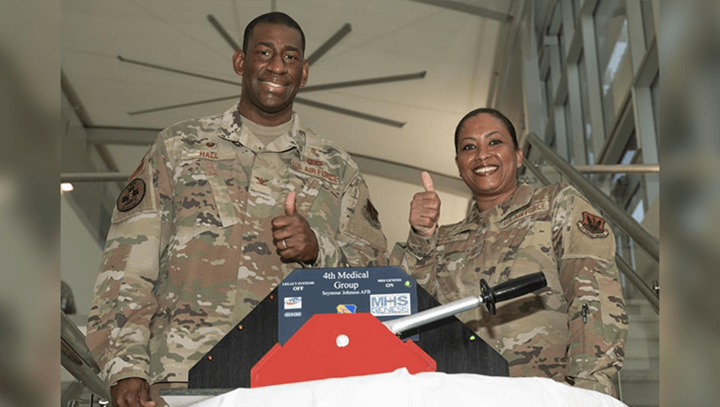 Image of Air Force Col. Dolphis Hall, 4th Medical Group commander, left, and Chief Master Sgt. Kaleah Belin, 4th MDG senior enlisted leader, pose for a photo at the Thomas Koritz Medical Clinic at Seymour Johnson Air Force Base, North Carolina, March 19, 2022. (Photo: Air Force Senior Airman Kimberly Barrera).
