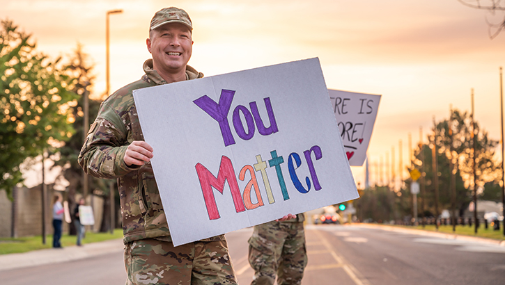 Col. Daniel Voorhies, 341st Missile Wing vice commander, holds a sign reading, “You Matter” for Airmen entering the installation Sept. 9, 2022 at Malmstrom Air Force Base, Mont. This was part of the third annual Signs of Hope event during Suicide Prevention Month. (U.S. Air Force photo by Heather Heiney)