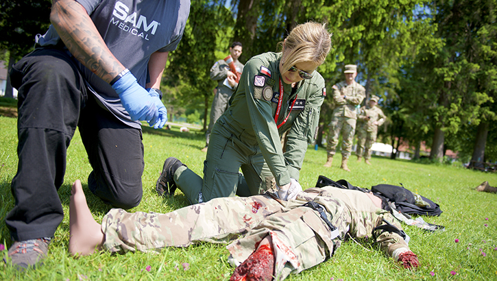 Polish Air Force Medic, 1st Lt. Marzena Dudaryk, administers Tactical Combat Casualty Care during a simulation session at the U.S Air Forces in Europe - Air Forces Africa European-African Military Nurses Exchange Conference on May 31, 2023.  
