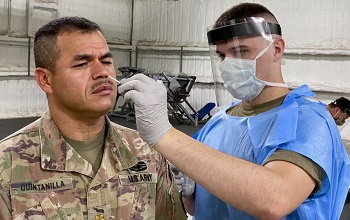 Soldier getting  nasal swab test for COVID-19