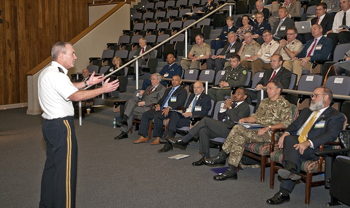 Army Major General Jeffrey B. Clark, director of the Health Operations Directorate at the Defense Health Agency, addresses military health leaders from over 13 nations at the October 2015 event 