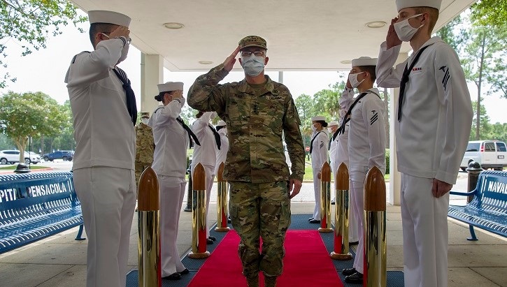 Lt. Gen. Ronald Place saluting to soldiers