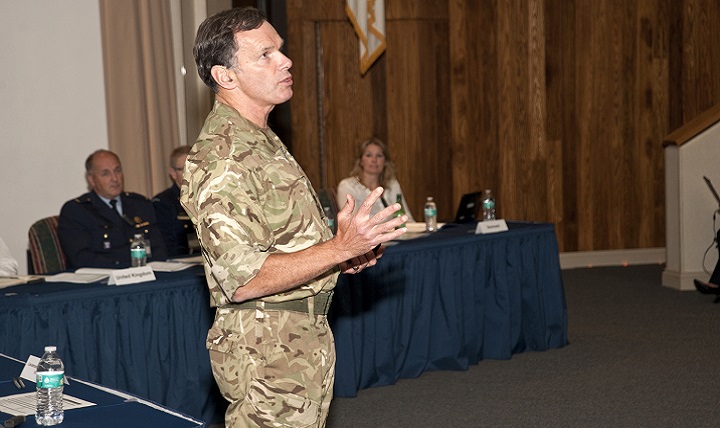 Lieutenant General Andrew Gregory, Chief of Defense Personnel in the United Kingdom Armed Forces, addresses symposium attendees
