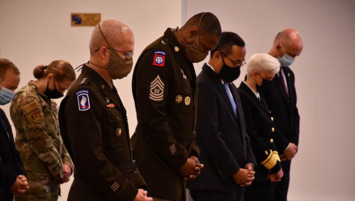 Image of Defense Health Agency Director Army Lt. Gen. (Dr.) Ronald Place and Command Sgt. Maj. Michael Gragg bow their heads for the invocation prayer during a ceremony marking the 20th anniversary of the terrorist attacks on September 11, 2001, at DHA headquarters in Falls Church, Virginia, Sept. 10.