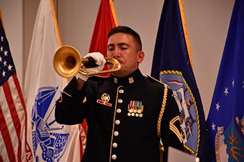 Sgt. 1st Class Kevin Gebo plays taps at the conclusion of a ceremony marking the 20th anniversary of the terrorist attacks on September 11, 2001, at Defense Health Agency headquarters in Falls Church, Virginia, Sept. 10.
