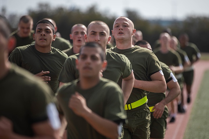 Image of Marine Corps Recruit Depot, San Diego  Recruits with Bravo Company, 1st Recruit Training Battalion, hydrate after a physical training session.