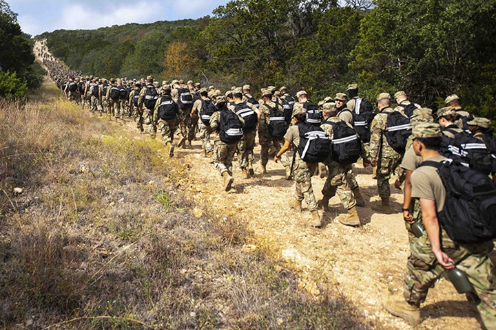 Image of Airmen participate in the 13th Annual Fallen Defender Ruck March at Joint Base San Antonio, Nov. 6, 2020. The event honors 186 fallen security forces, security police and air police members who have made the ultimate sacrifice. Photo By: Sarayuth Pinthong, Air Force.