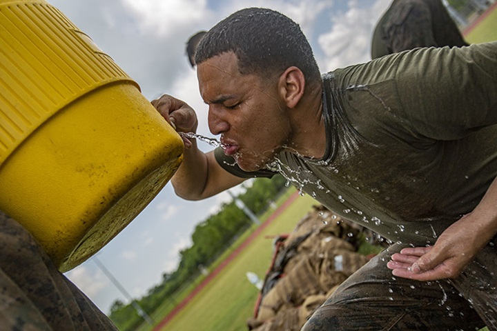 Image of Marine Corps Cpl. Luis Alicea drinks water after a combat conditioning exercise at Naval Air Station Joint Reserve Base New Orleans, May 20, 2019. Photo By: Marine Corps Lance Cpl. Jose Gonzalez.