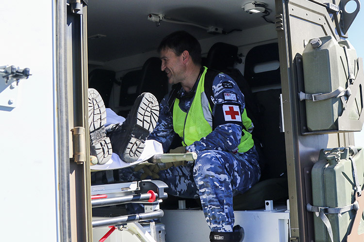 Flight Lt. Michael Campion, an aviation medical officer from No. 3 Aeromedical Evacuation Squadron prepares a medical patient leaving Exercise Talisman Sabre to be transferred to a C-27J Spartan aircraft July 18, 2019 at Rockhampton Airport. No. 3 Aeromedical Evacuation Squadron is providing medical support to troops participating in Talisman Sabre 2019, a bilateral combined Australian and United States exercise designed to train respective military services in planning and conducting Combined and Joint Task Force operations, and improve the combat readiness and interoperability between Australian and US forces. (U.S. Army photo by Sgt. 1st Class John Etheridge)