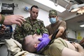 Medical Service members prepare resuscitation on patient