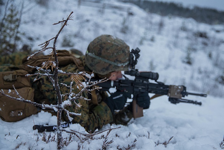 Image of A U.S. Marine with Marine Rotational Force-Europe (MRF-E) 19.1 maintains a defensive security position during Exercise Winter Warrior in Haltdalen, Norway, Dec. 5, 2018. The three-week exercise tested the Marines' abilities to adapt to harsh weather conditions, move across long distances in the snow and push themselves to complete the mission despite austere situations. (U.S. Marine Corps photo by Cpl. Elijah Abernathy/Released).