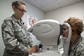 Senior Airman Breanna Daniels, 559th Medical Group optometry technician, takes images of Tech. Sgt. Stephanie Edmiston, 559th MDG trainee health flight chief, during an eye exam Oct. 19 at the Reid Clinic on Joint Base San Antonio-Lackland, Texas. The 559th MDG is home to the largest optometry and public health flight in the Department of Defense; the DOD's first military training consultation service. (U.S. Air Force photo/Staff Sgt. Kevin Iinuma)