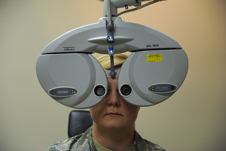 Image of A phoropter is an instrument used to determine an individual’s eyeglass prescription by measuring the eye’s refractive error and switching through various lens until the persons vision is normal. (U.S. Air Force photo by Airman Dennis Spain). Click to open a larger version of the image.