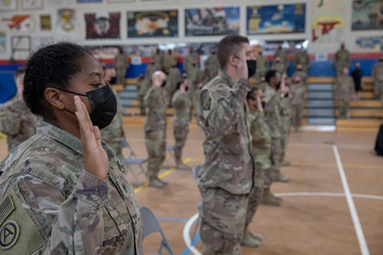 U.S. Army Central Reserve component Soldiers swear the oath of enlistment during a mass reenlistment ceremony in celebration of the U.S. Army Reserve 113th birthday at Camp Arifjan, Kuwait, April 23, 2021.