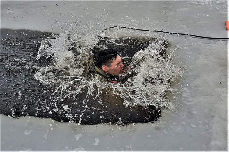 A student participates in a cold-water immersion training at Fort McCoy, Wis., Jan. 17, 2020, as a part of the Cold-Weather Operations Course. (Photo By Scott Sturkol, Army)