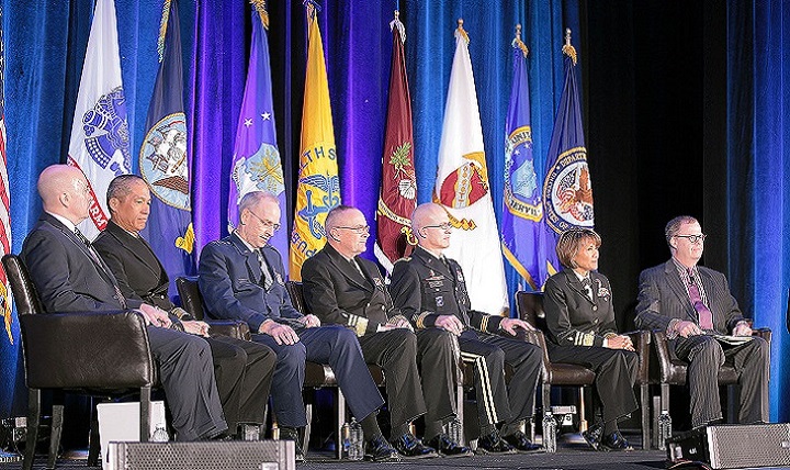 From left, Retired Army Maj. Gen. Richard Thomas, president of Uniformed Services University of the Health Sciences;  Navy Rear Adm. Colin Chinn, Joint Staff surgeon; Air Force Lt. Gen. Mark Ediger, Air Force surgeon general; Navy Vice Adm. Forrest Faison III, Navy surgeon general; Army Maj. Gen. Ronald Place, for the Army surgeon general; Navy Vice Adm. Raquel Bono, director of the Defense Health Agency; and Tom McCaffery, acting assistant secretary of defense for health affairs. (Courtesy photo)