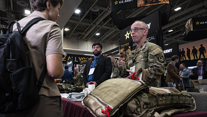 U.S. Army Col. Andy Nuce, commander of the U.S. Army Medical Materiel Development Activity, speaks with a visitor to the U.S. Army Medical Command exhibit as part of the Association of the United States Army 2023 Annual Meeting and Exposition, Washington, Oct. 11, 2023.  (Photo by T. T. Parish/U.S. Army) 