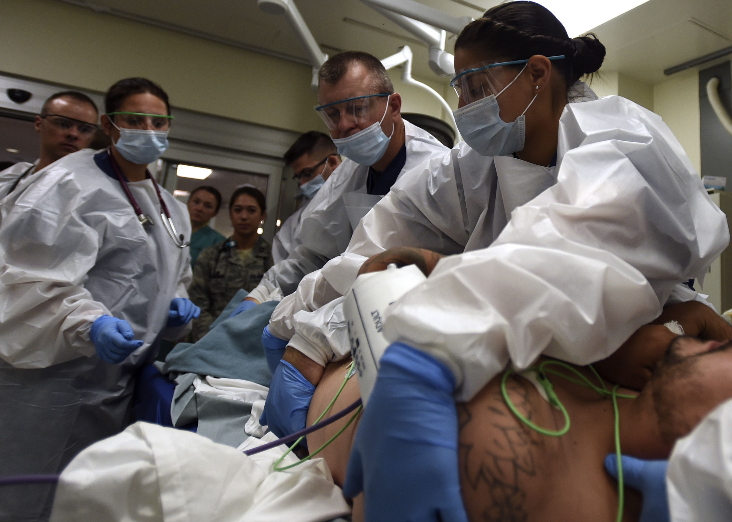 San Antonio Military Medical Center Emergency Department staff treat a patient on Joint Base San Antonio-Fort Sam Houston, Texas. The emergency department serves 20 counties in the Texas region and treats roughly 200 patients a day. (U.S. Air Force photo by Staff Sgt. Kevin Iinuma)