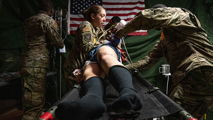 Airmen from the 934th Aeromedical Staging Squadron turn a mannequin over during a training exercise on Oct. 15, 2023, at Regions Hospital in St. Paul, Minnesota. The exercise involved realistic wounds and training equipment to simulate a true combat casualty care environment. (Photo by U.S. Air Force Senior Airman Victoriya Tarakanova)