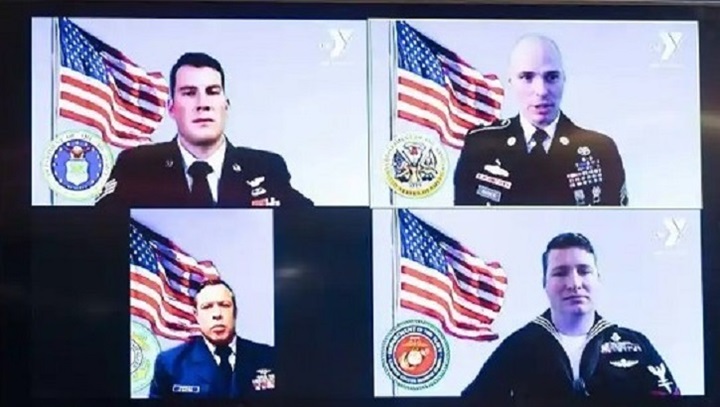 Image of Four military personnel shown during a Zoom call.