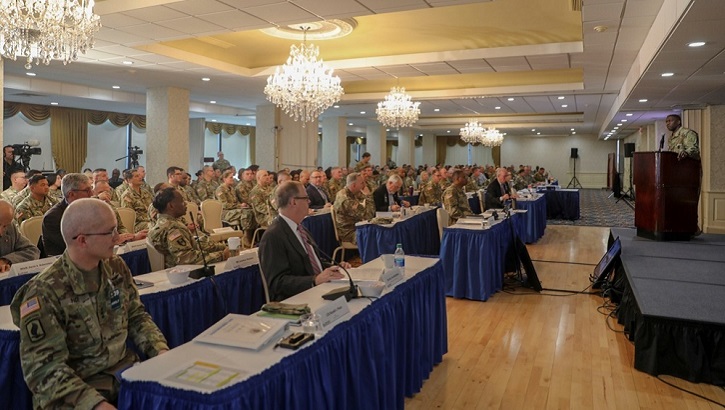 Key leaders at the Army Medicine Senior Leader Forum watch Lt. Gen. R. Scott Dingle, Army Surgeon General, at podium during the Army Medicine Senior Leaders Forum on Jan. 28, 2020, to discuss issues related to the transformation of Army Medicine and how to manage the way ahead to ensure optimal medical readiness for soldiers and all military medical beneficiaries. Attendees include the Director of the Defense Health Agency, Army  Lt. Gen. Ronald Place (left foreground), and Assistant Secretary of Defense (Health Affairs) Thomas McCaffery (center foreground). The forum was held at Fort Belvoir and involved about 350 leaders. (U.S. Army photo by Jenie Fisher)