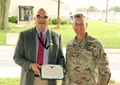 Army Col. John “Ryan” Bailey, right, commander of the U.S. Army Medical Materiel Agency, presents Chris Roan with the Civilian Service Commendation Medal during Roan’s retirement ceremony Sept. 17 at Fort Detrick, Maryland. Roan retires with nearly 40 years of federal service.